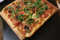 Grandma Pie with Wild Boar Sausage and Arugula